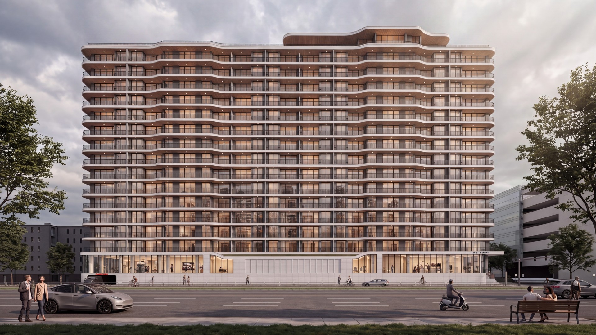 A rendering shows a tall apartment building with curved white balconies and a glass-fronted ground floor, with pedestrians, cars and a scooter rider on the street in front.