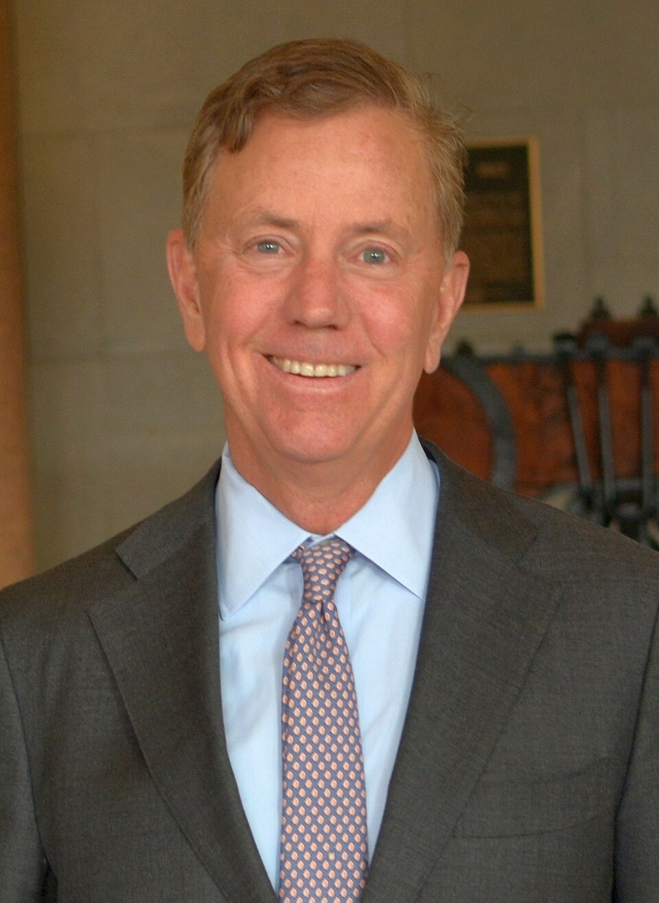 Connecticut Gov. Ned Lamont poses for his official portrait in the state Capitol.