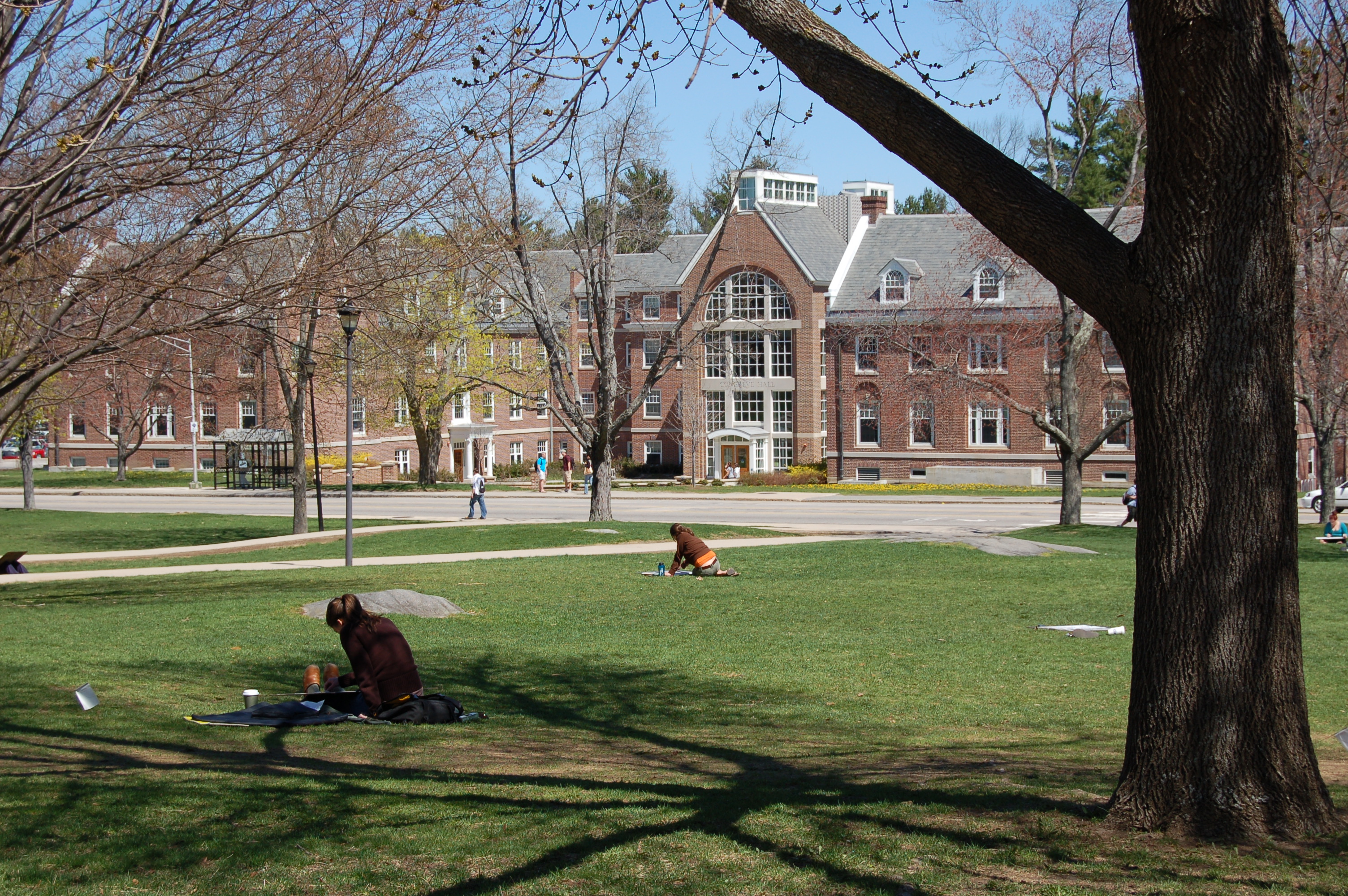 Congreve Hall on the University of New Hampshire campus, seen across a green lawn.