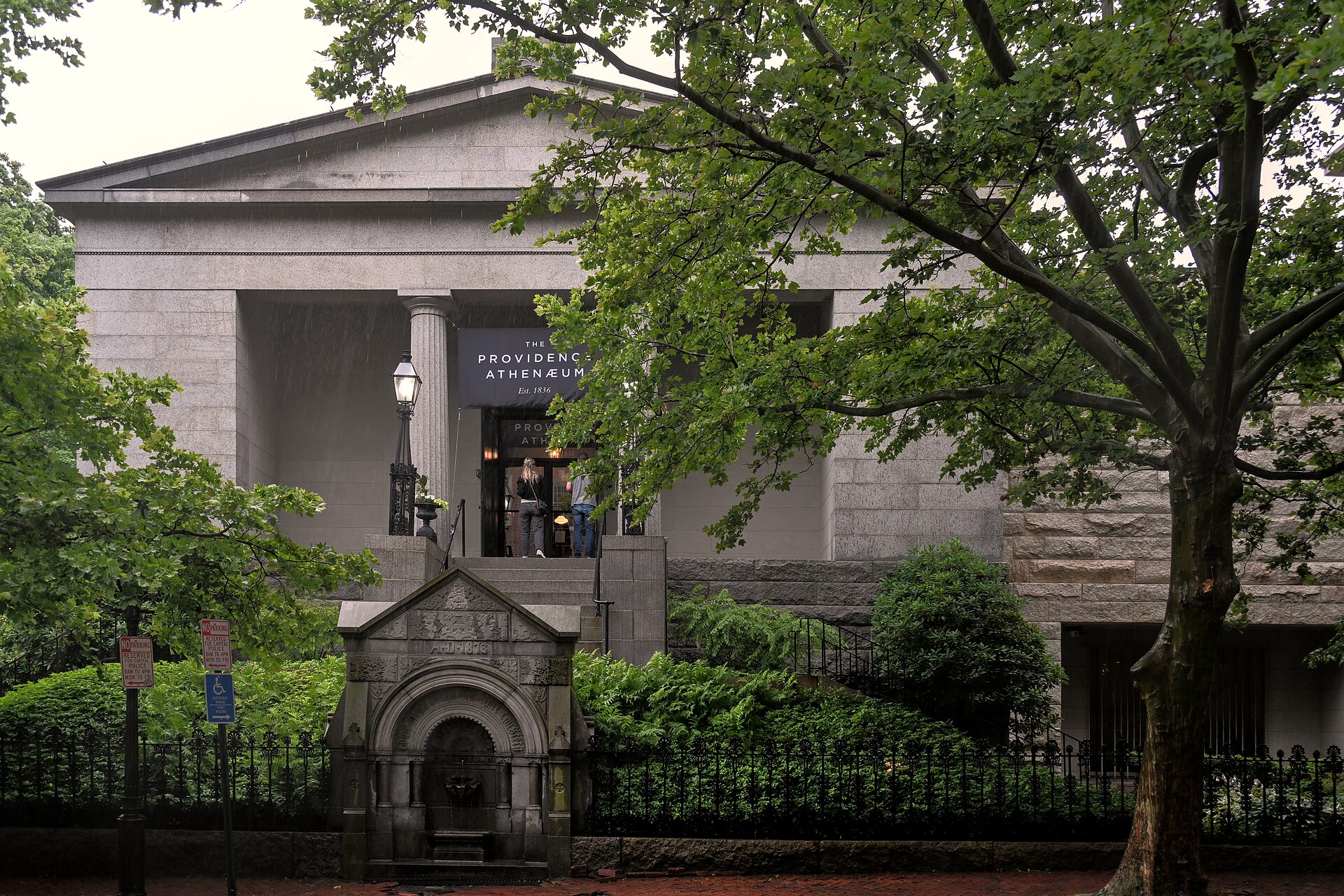 The Providence Athenaeum entrance and columns behind trees.