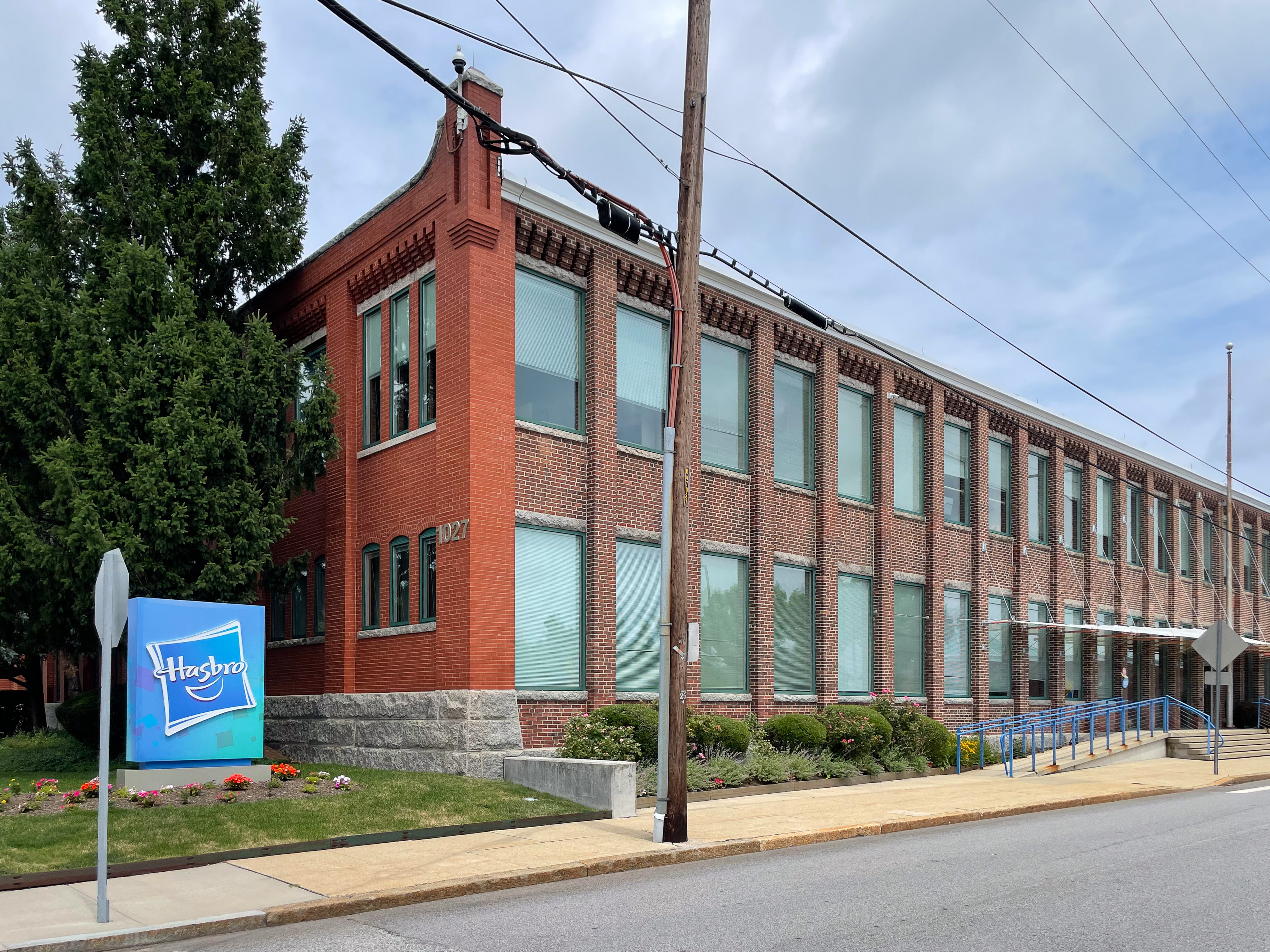 Hasbro's brick headquarters building and sign on Newport Avenue in Pawtucket.