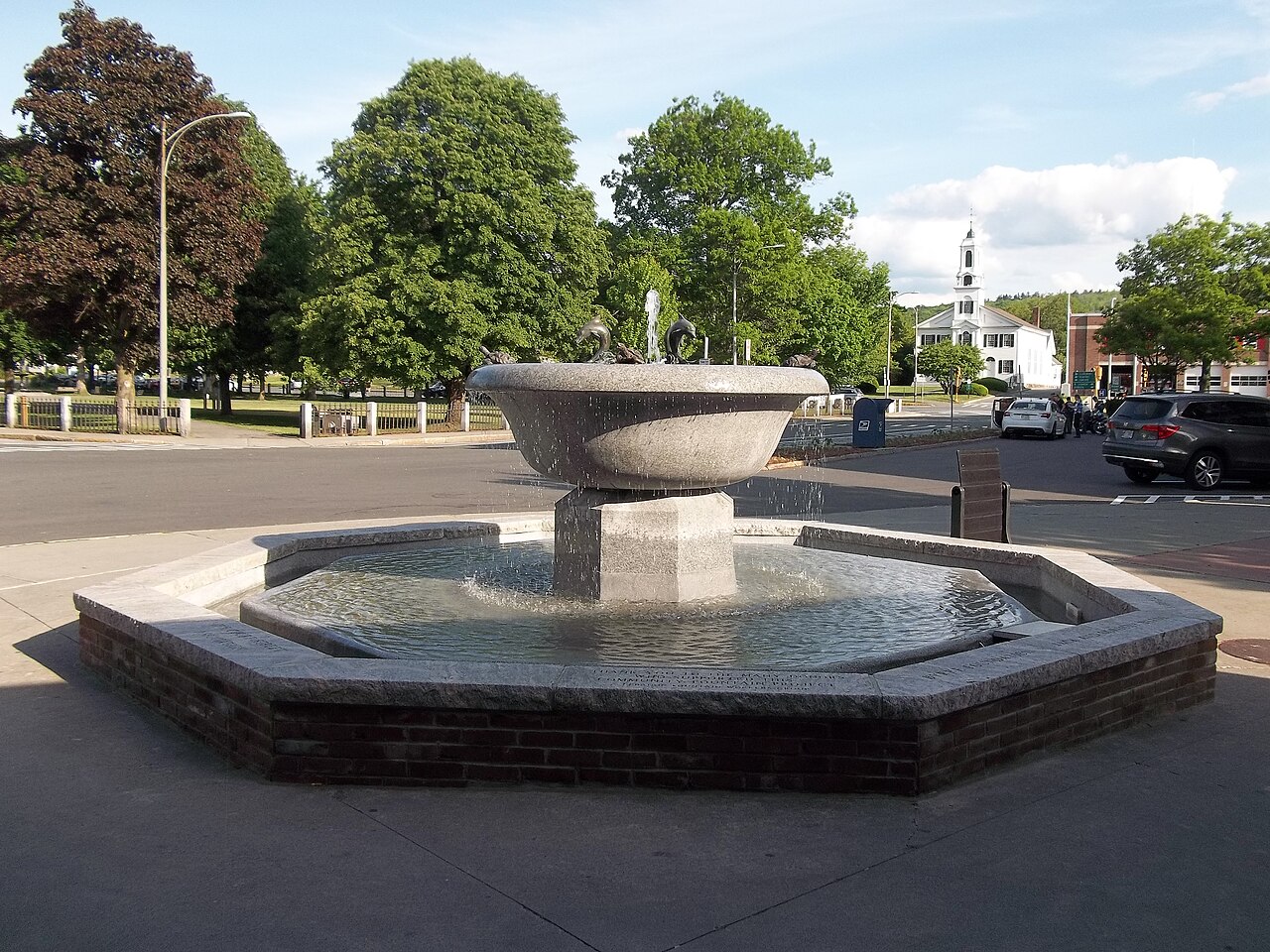 A fountain and surrounding buildings in downtown Lebanon, New Hampshire.