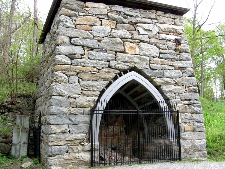 The stone Kent Iron Furnace on the Eric Sloane Museum grounds.
