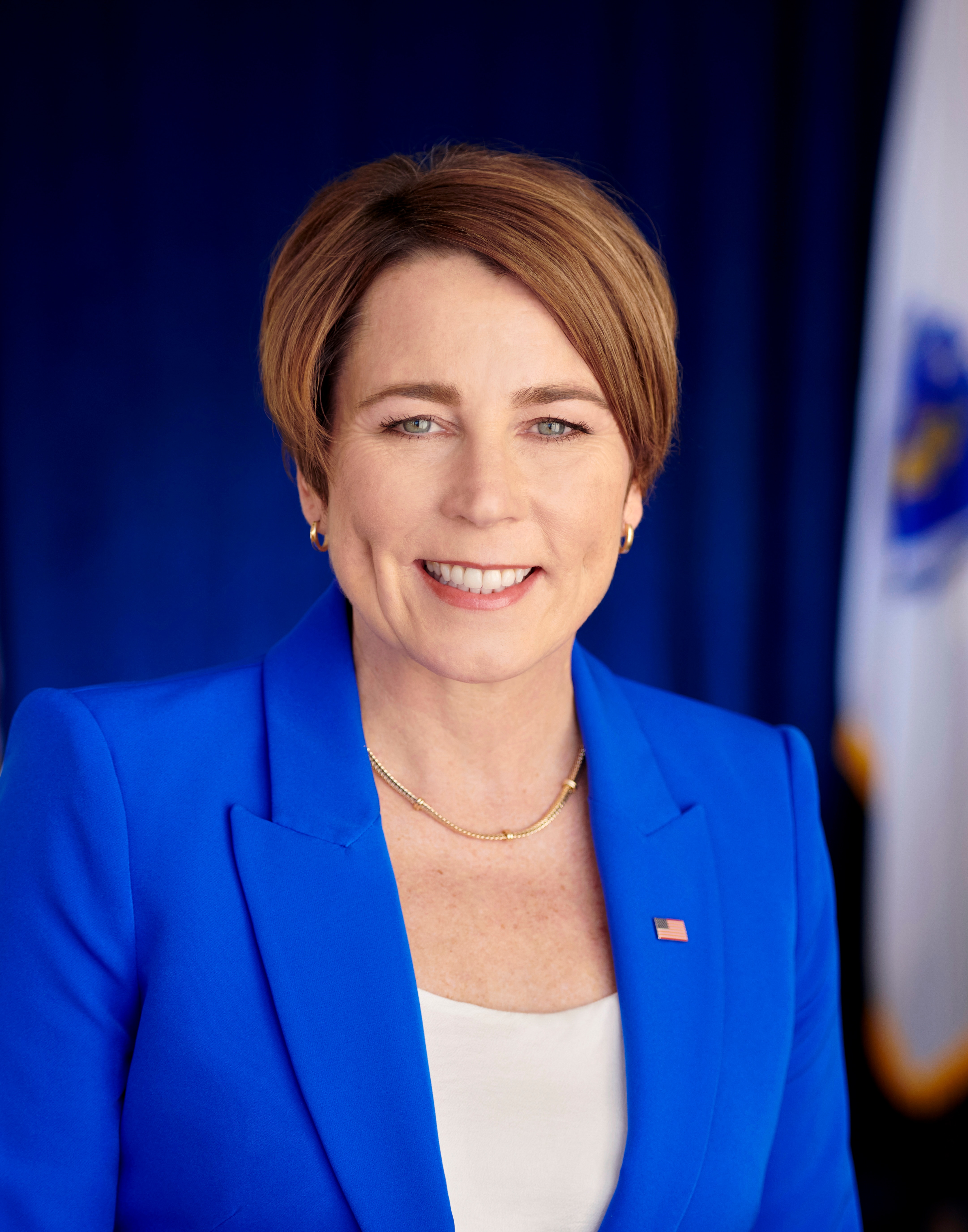 Official portrait of Massachusetts Gov. Maura Healey in a blue jacket.
