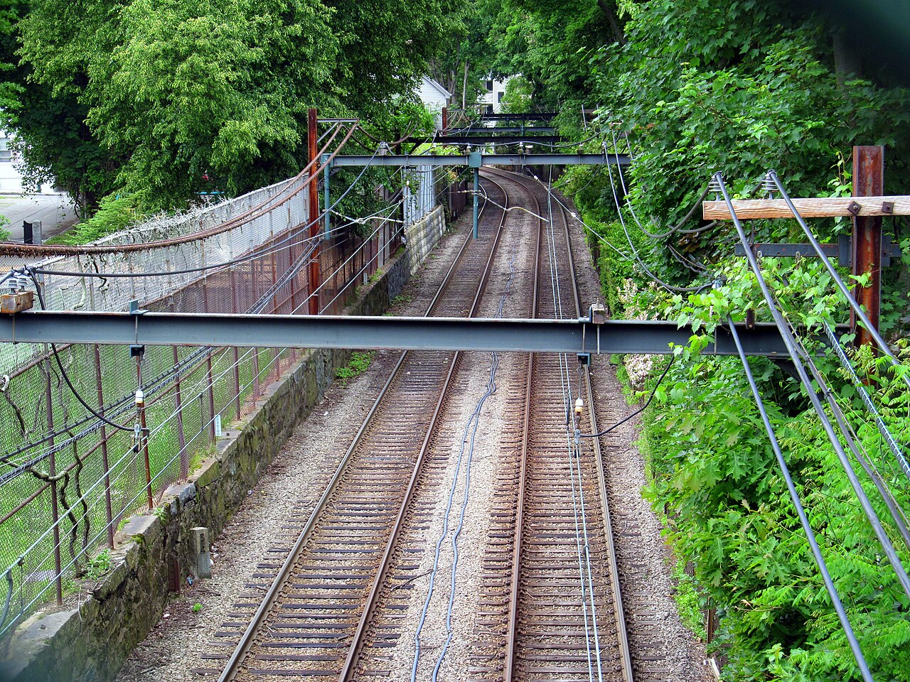 Green Line D branch tracks viewed from the Davis Path footbridge in Brookline in June 2014.